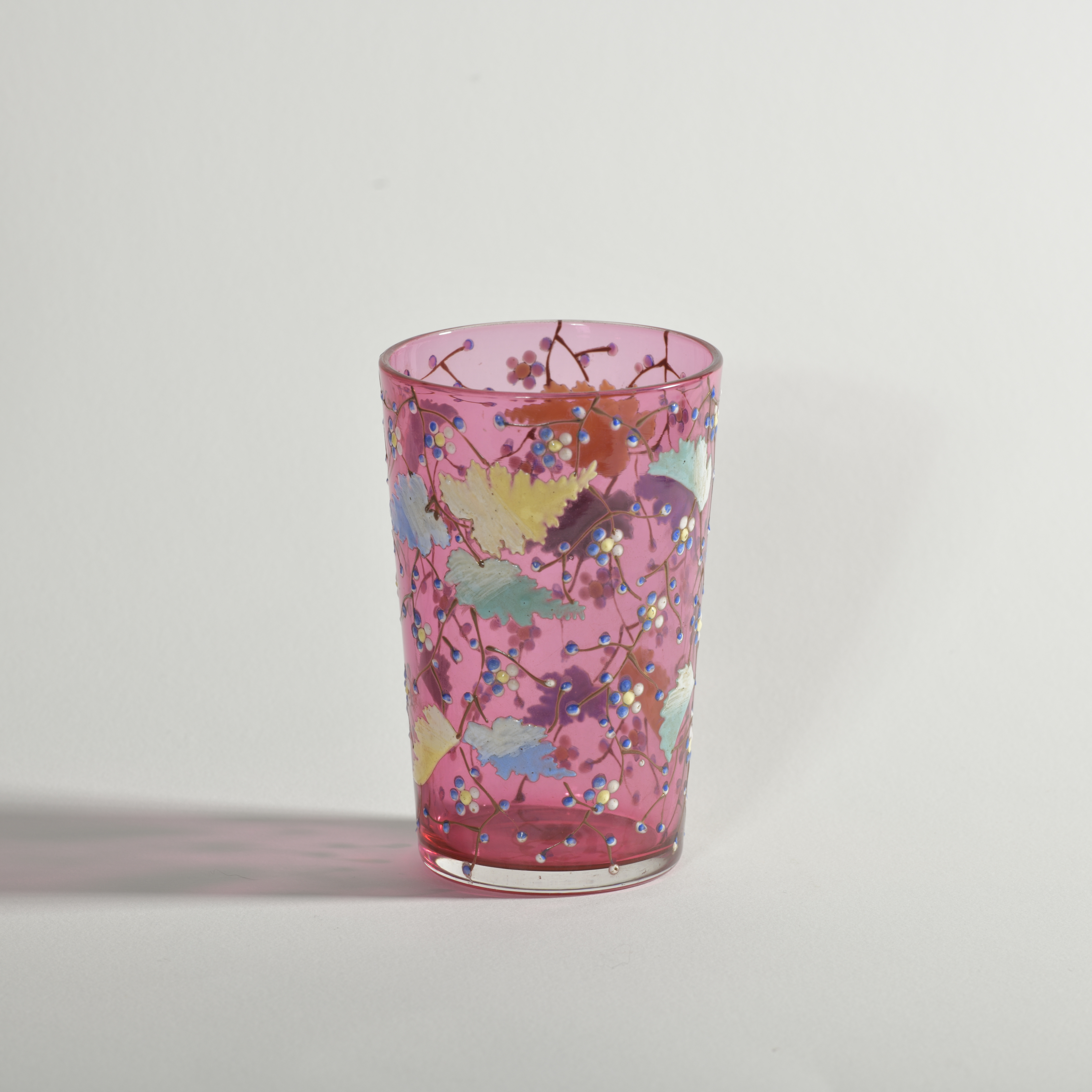 Antique Moser style ruby glass tumbler with enamelled leaves, vines and flowers