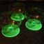 Uranium glass dishes glowing under UV light